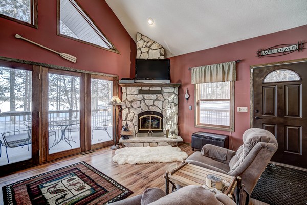 Century 21 cabin interior with stone fireplace