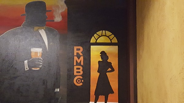 Brewery sign with old fashioned man smoking a cigar