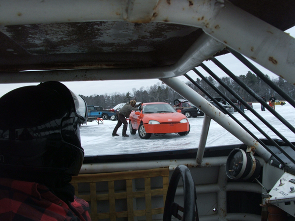 Pat Duffy Race car driver looking at other cars on the frozen lake