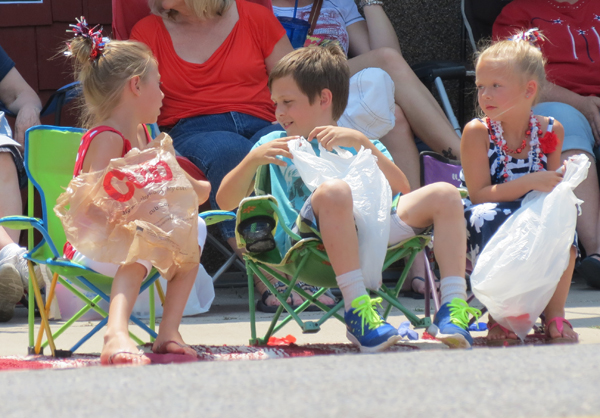 Kids hoping there will be candy at this parade