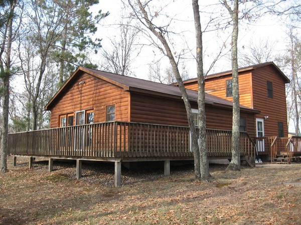 On over 11 acres near the Gandy Dancer Trail and Danbury, 4 bedrooms and frontage on Round Lake