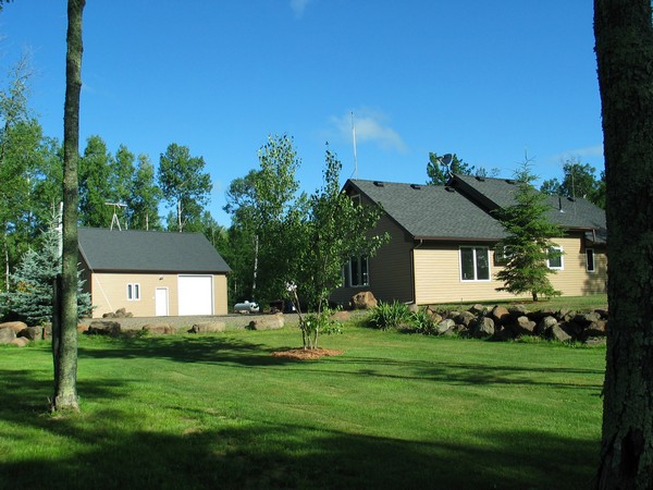40 wooded acres, heated 3 car "super" garage with loft