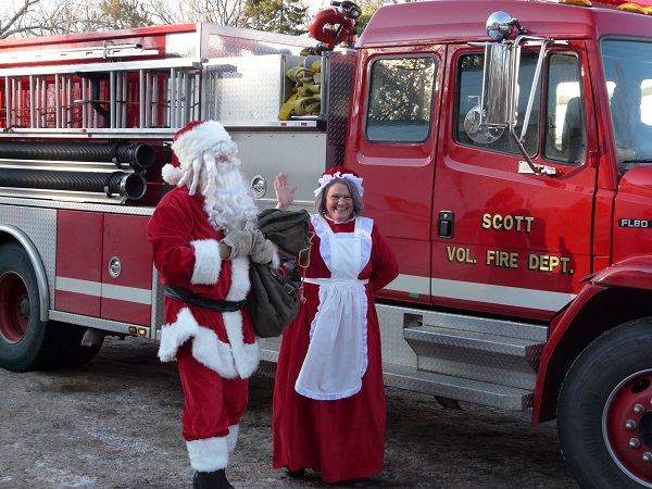 A stylish arrival for Santa and Mrs. Santa Claus