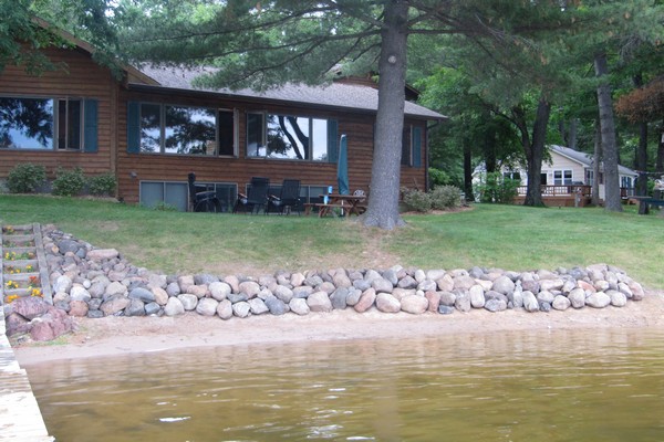 Cabin property with rising water levels covering beach