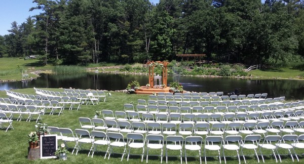 Coyland venue space with seating and arch by water