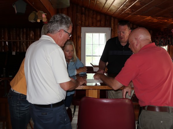 Century 21 Sand County agents discussing inside propery