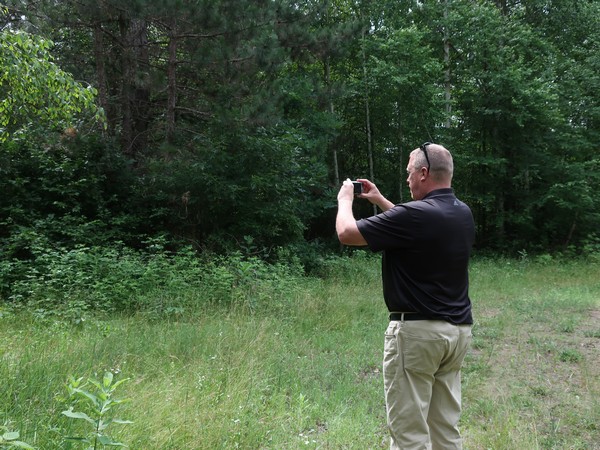 Century 21 agent taking photos of a property