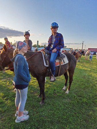 Girl on horse getting ready for horse showdeo