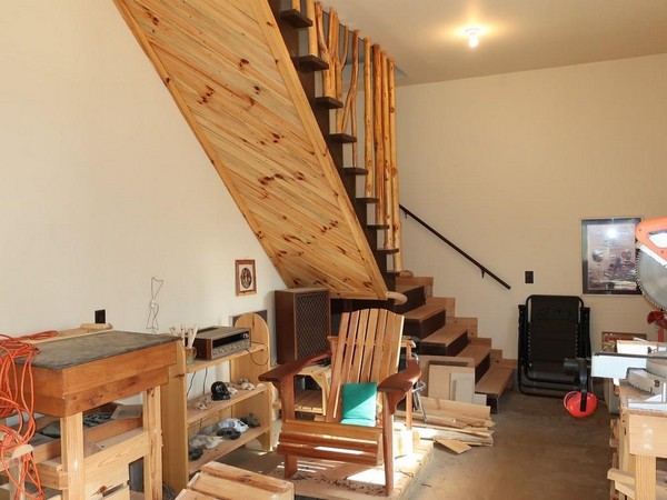 Wood working shop with stairs leading upstairs