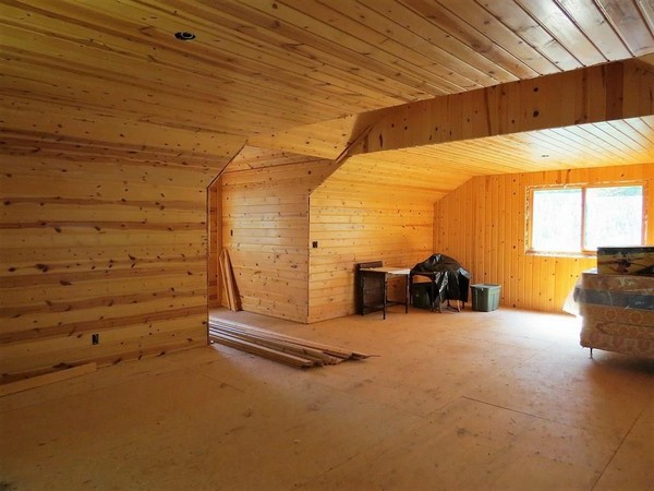 Wood walls and ceiling interior of garage upstairs