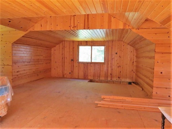 Wood walls and ceiling interior of garage upstairs 2