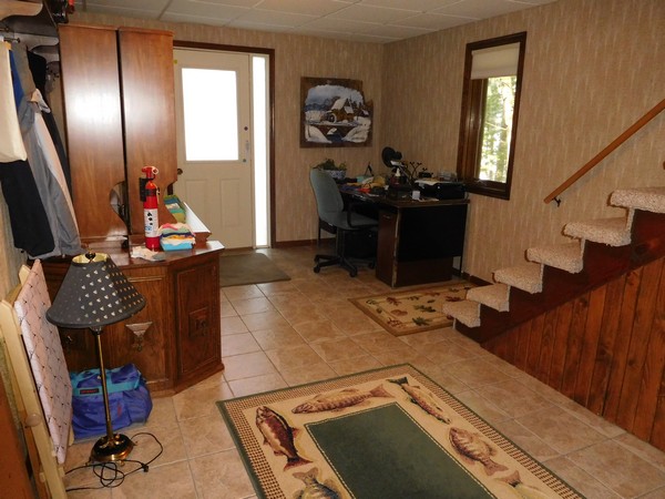 Front entry hallway littered with items