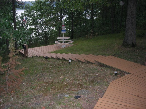 Steps from cabin down to landing area and lake