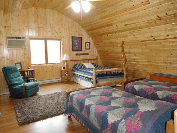 Bedroom with many beds and matching bed spreads