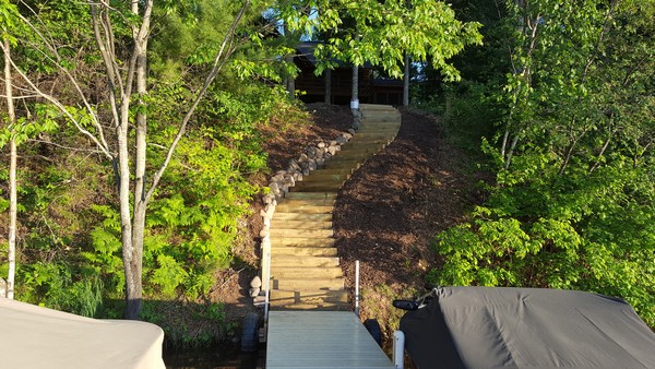 View from dock of curved steps up to cabin