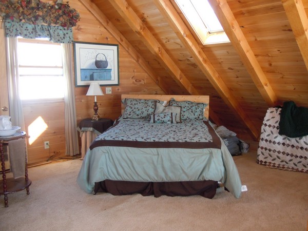 Bedroom with items tucked away behind bed