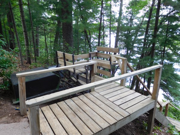 Wood steps from lakefront cabin property down to water