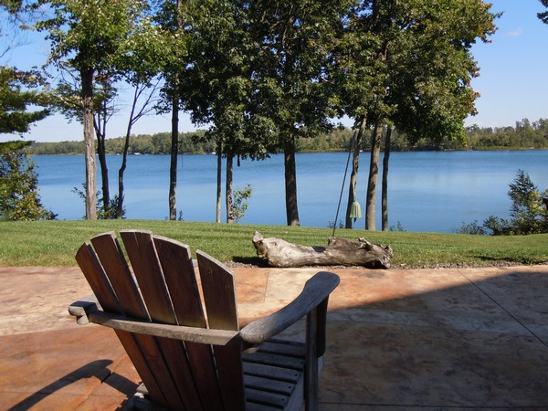 Lawn chair looking out to trees and lake