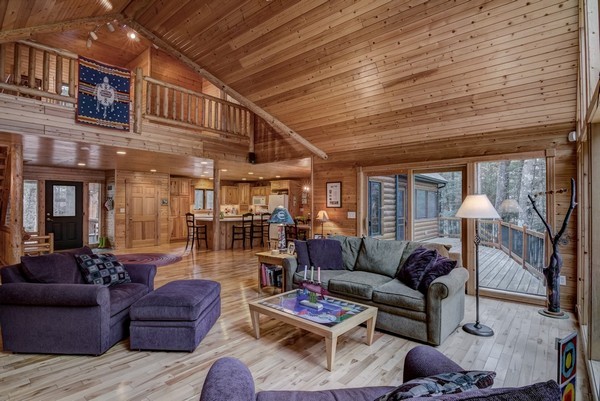 Wood floors, log accents, open loft and vaulted ceilings